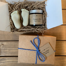 Load image into Gallery viewer, A gift set containing two foot-shaped soaps and a jar of foot cream, packaged in a brown Kraft box with paper shred and tied with a blue jute string.
All handmade, natural and vegan.
The packaging is eco friendly and plastic free.
A perfect pampering gift for walkers & ramblers or anyone who works on their feet all day.